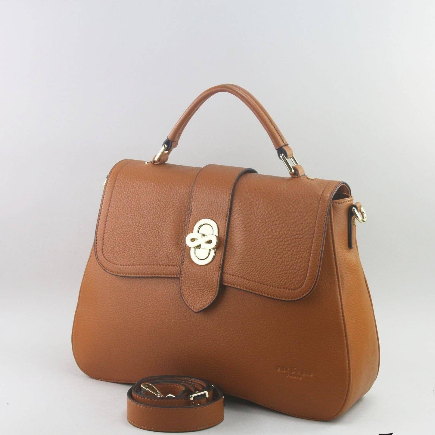 Brown leather laptop handbag with a silver clasp on a light grey background