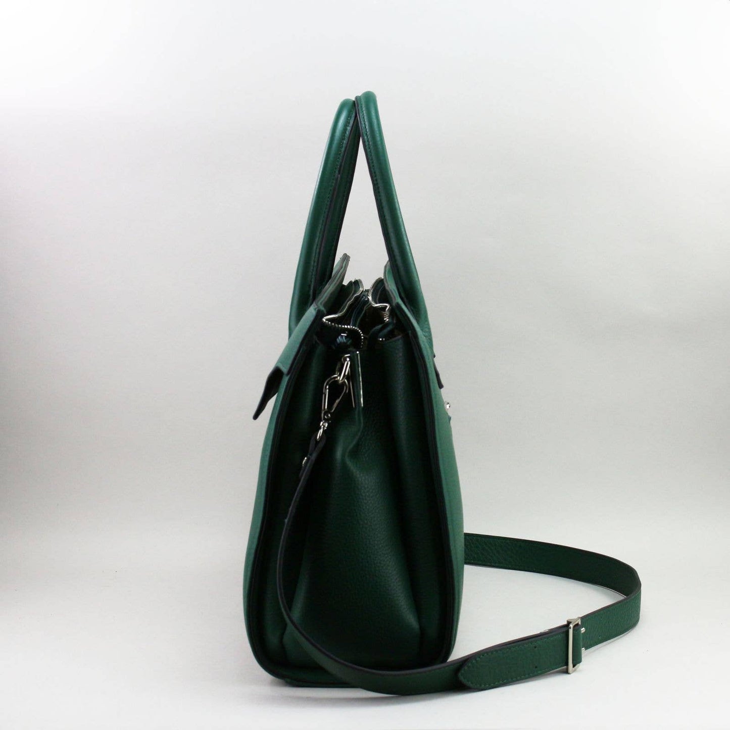 Green leather laptop handbag with a shoulder strap on a white background