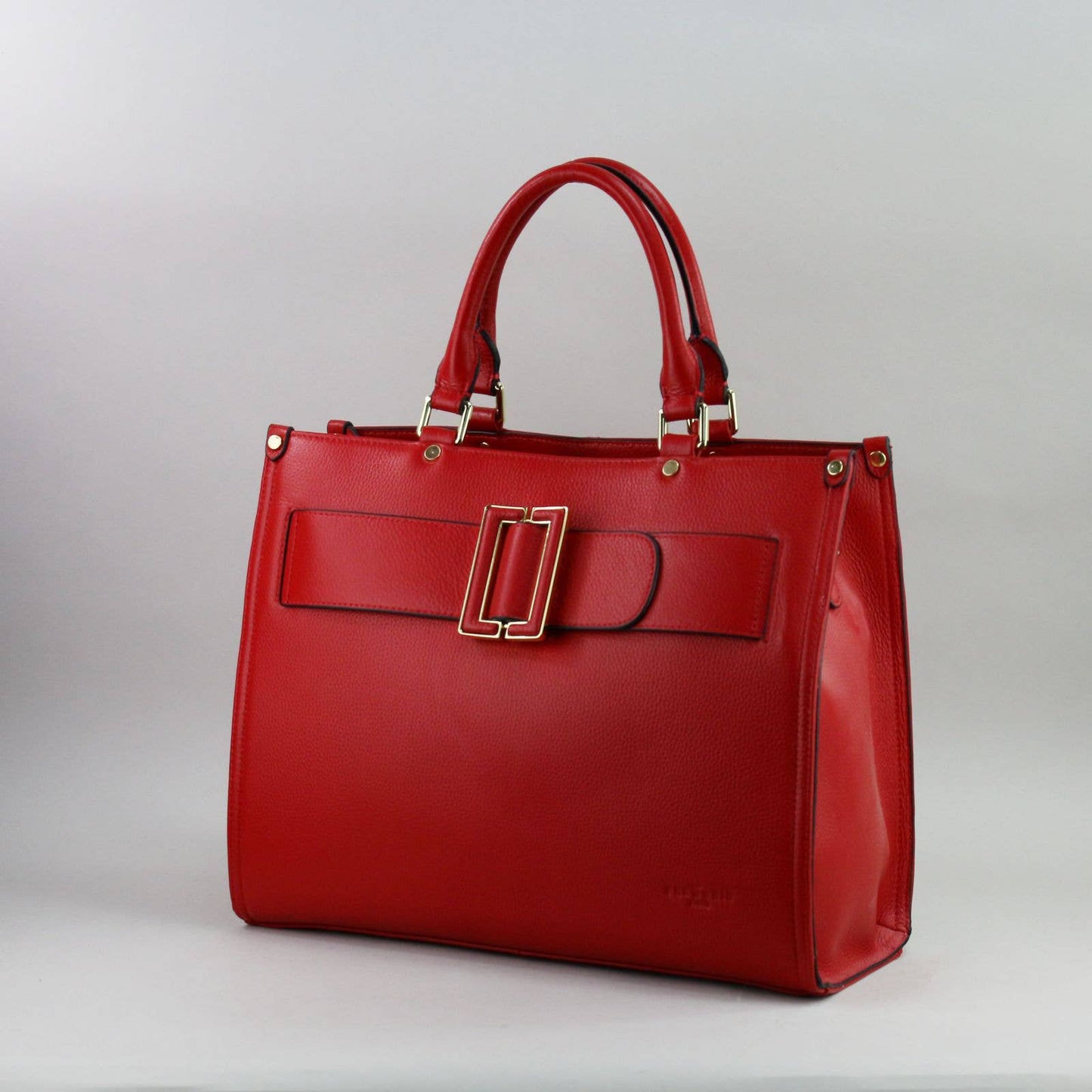 Red leather laptop handbag with a silver buckle on a light grey background