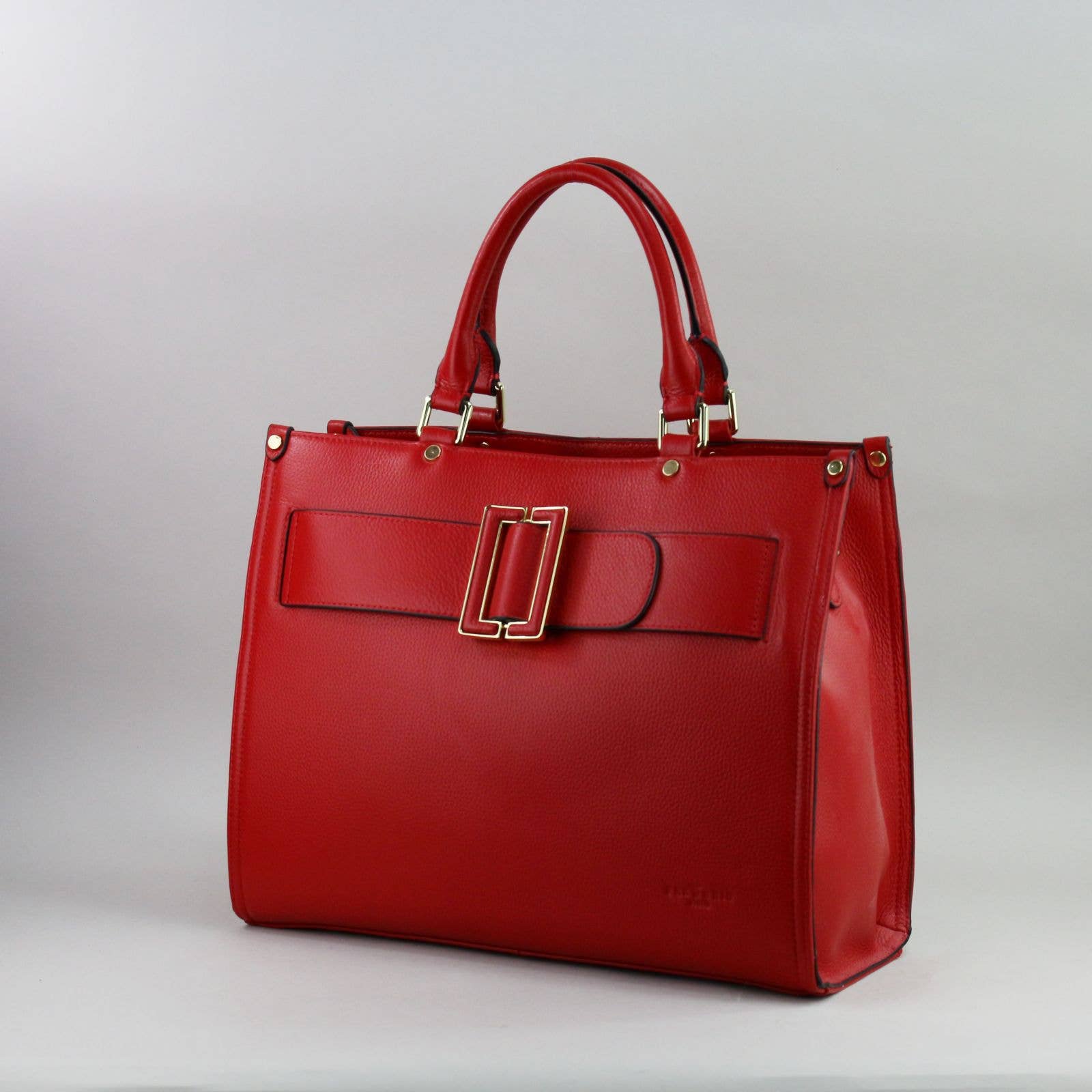 Red leather laptop handbag with a silver buckle on a light grey background