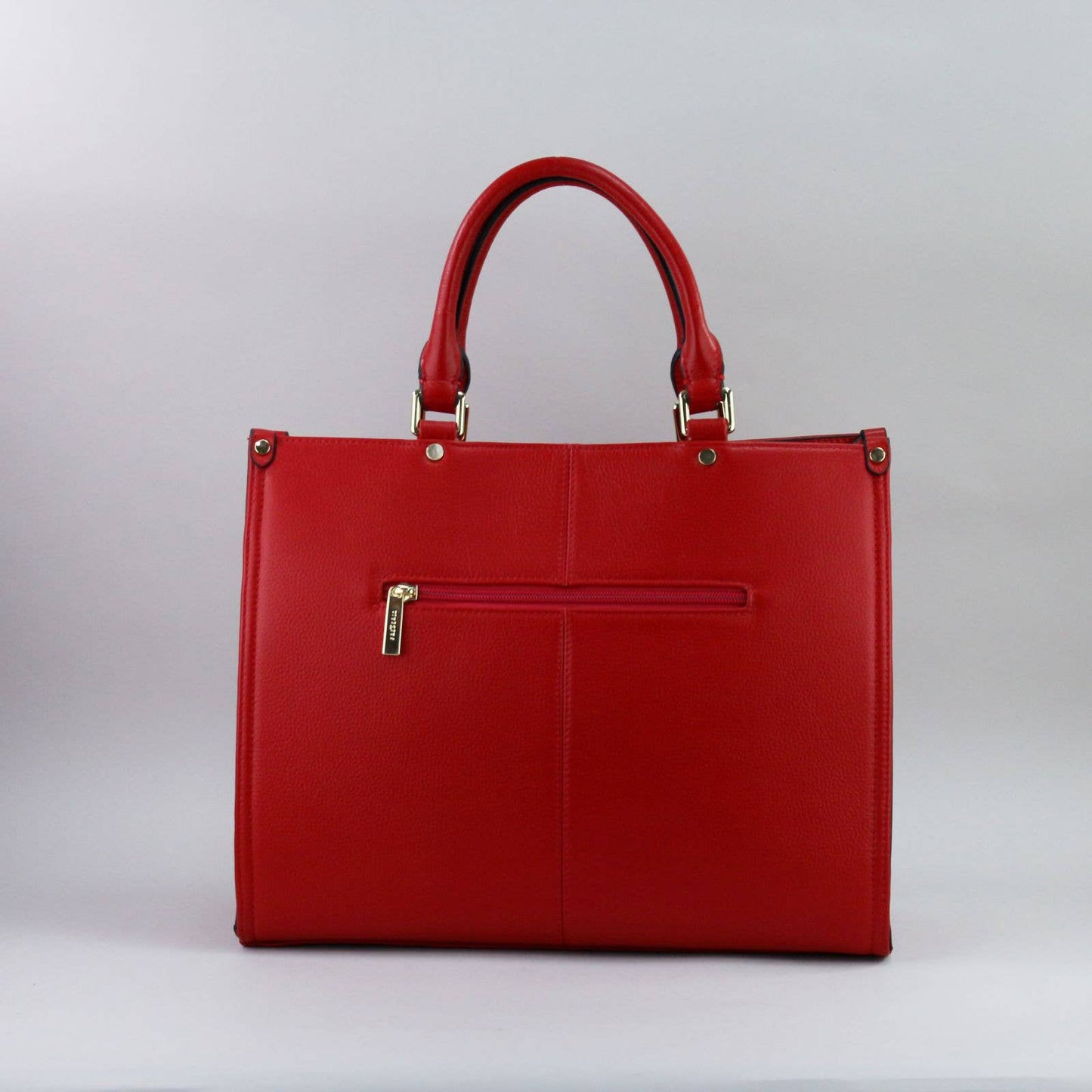 Red leather laptop handbag with a silver zipper on a light grey background