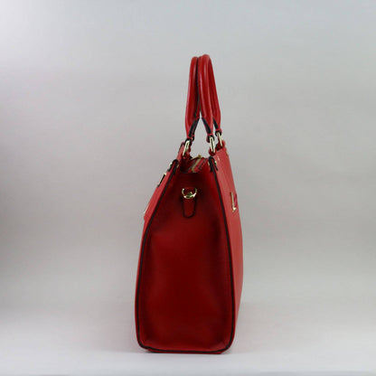 Red leather laptop handbag on a light grey background