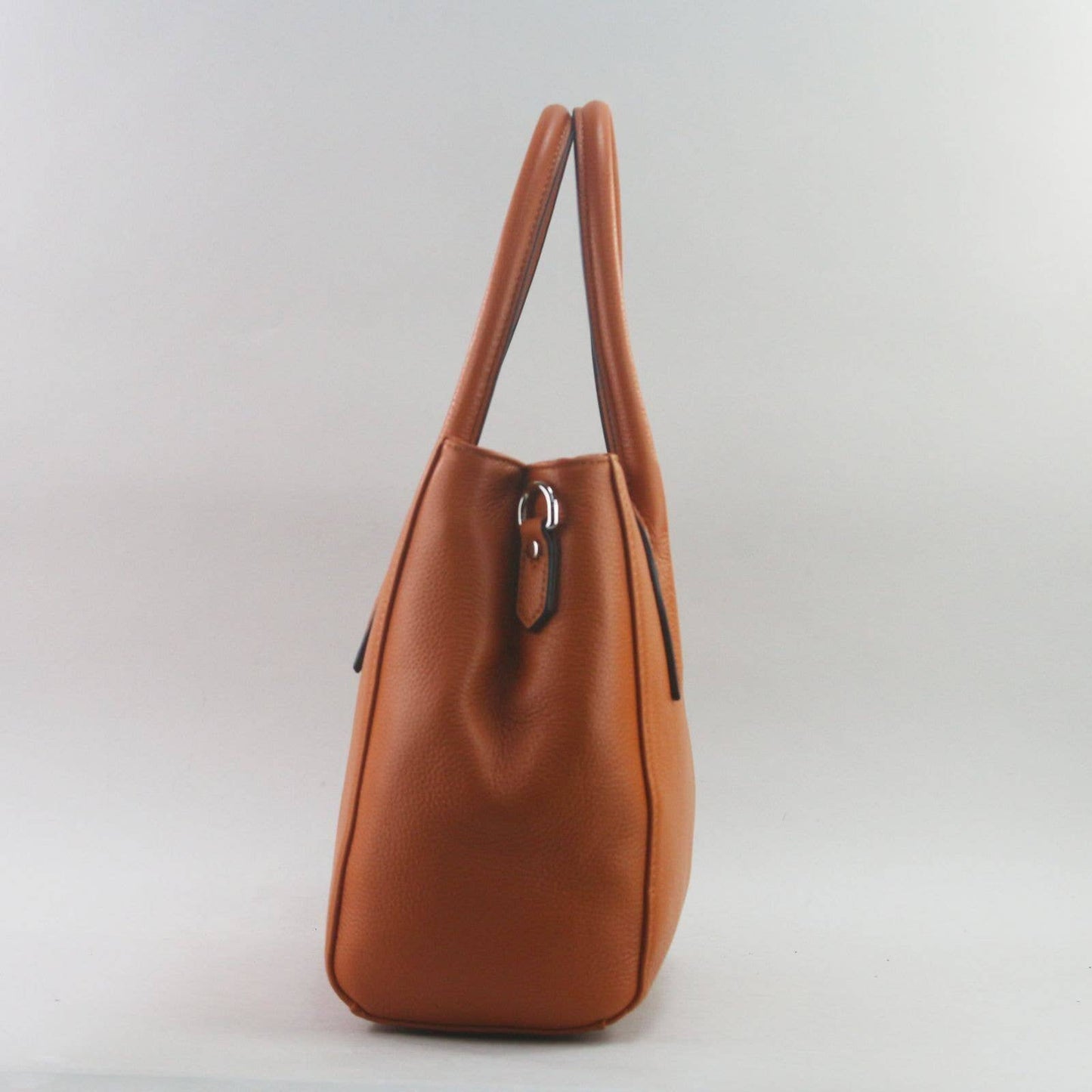 Orange leather laptop handbag on a light grey background